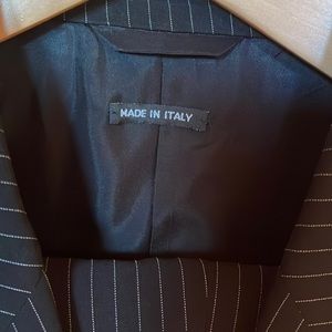 Giorgio Armani suit. 44 regular. Never been worn or altered. Black pinstripe.
